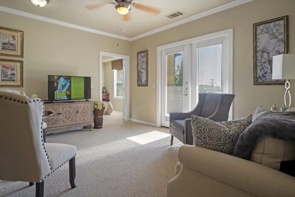 Bright interior with seating and a television