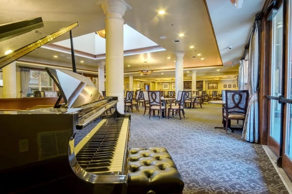 Interior view of a common area with a piano