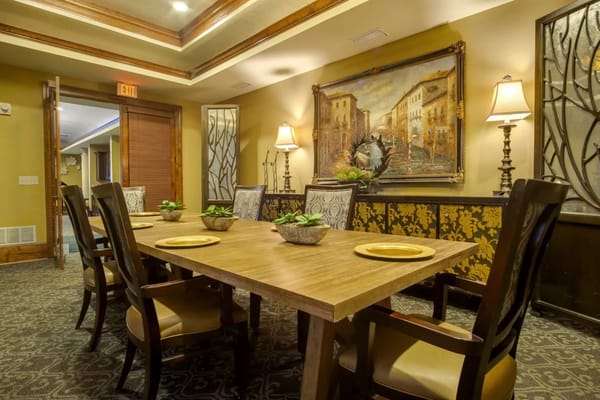 Elegant dining room with wooden table and wall art