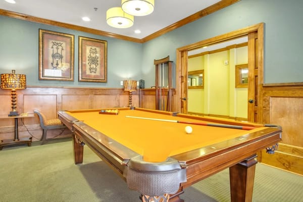 A pool table in a common area of the facility