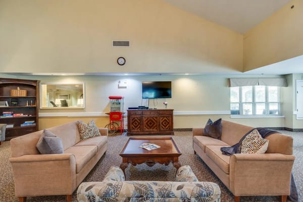 Bright common area with seating and a television