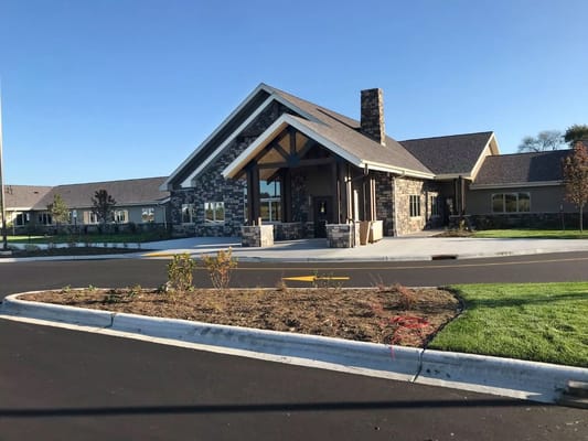 Front view of The Legacy of DeForest senior living facility