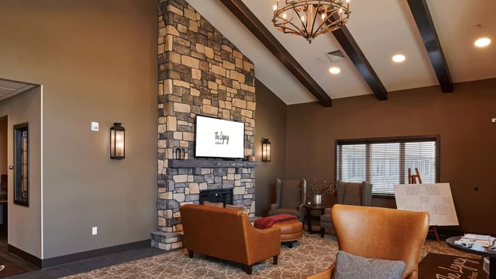 Comfortable seating area with a stone fireplace