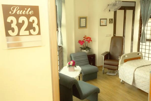 A private resident room with seating and floral decor