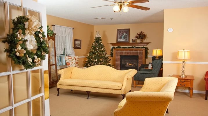 Cozy common area with festive decorations and comfortable seating