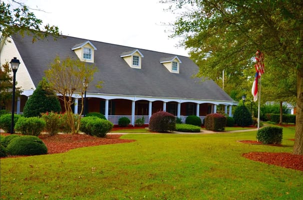 Exterior view of a nursing home building with gardens