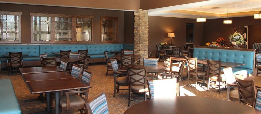 Spacious dining room with tables and seating