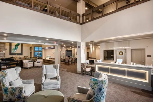 Bright and inviting lobby with comfortable seating and reception desk.