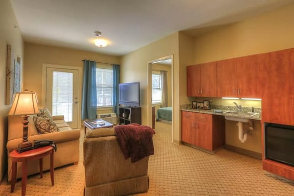Cozy interior of a resident's room with a kitchenette