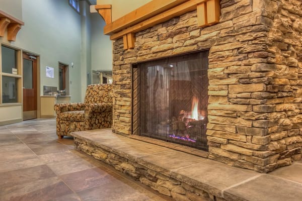 Cozy common area with a stone fireplace