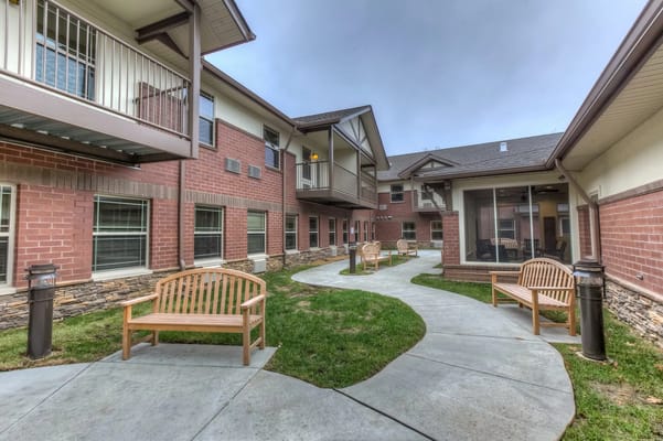 Well-maintained outdoor walking path with benches