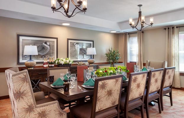 Elegant dining room setup with a large table and decorative chairs