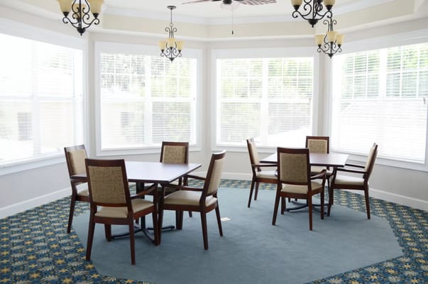 Bright common area with tables and chairs