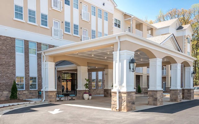 Covered entrance area with seating at The Mansions at Decatur