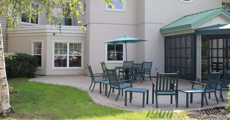 Outdoor seating area with tables and umbrellas