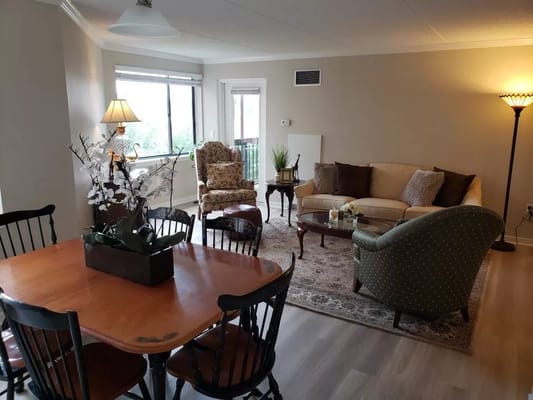 Cozy interior common area with seating and a dining table
