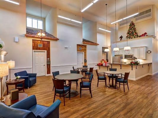 Spacious common area with seating and holiday decorations