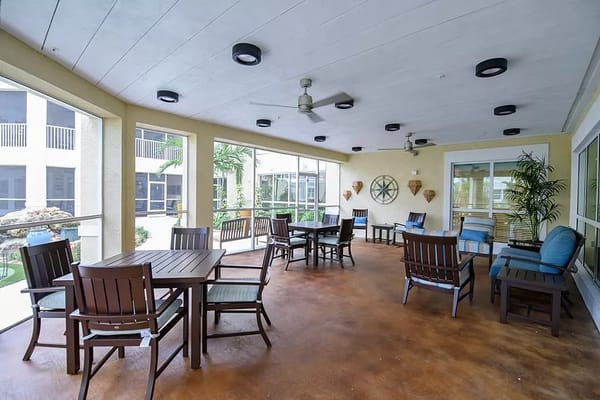 Outdoor seating area with tables and chairs