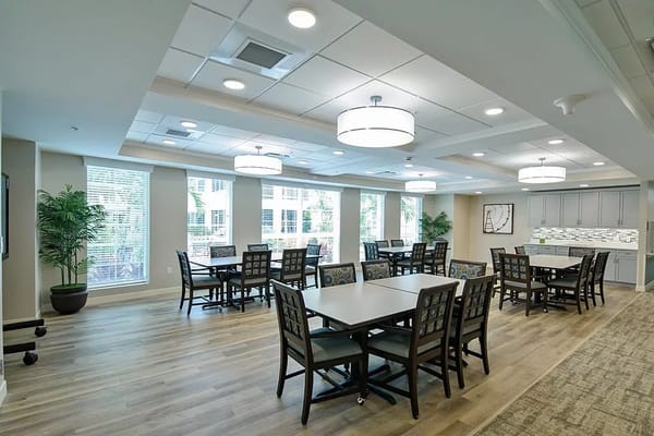 Bright common area with tables and chairs