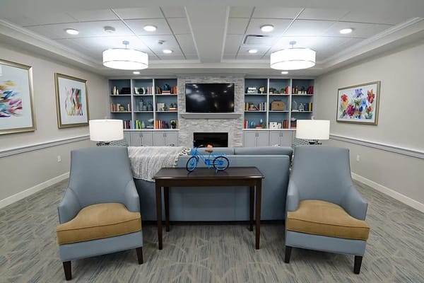 Interior common area with seating and bookshelves