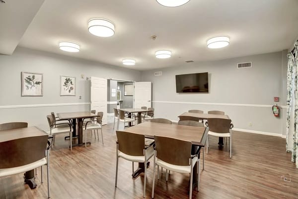 Spacious dining area with tables and chairs