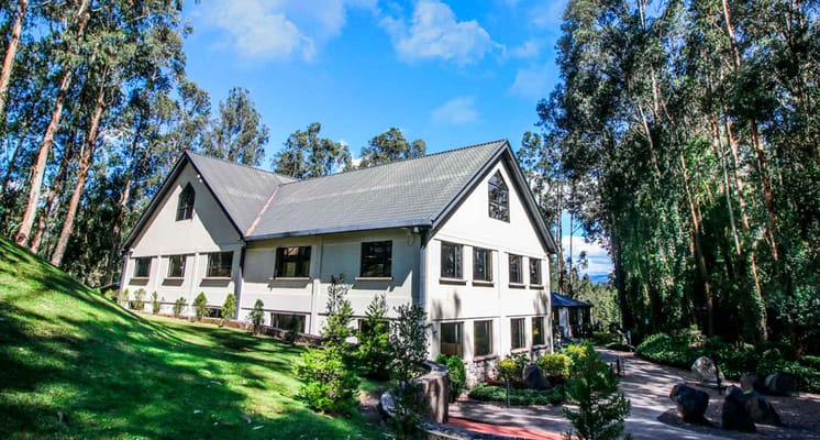 Exterior view of The Montebello Academy surrounded by greenery