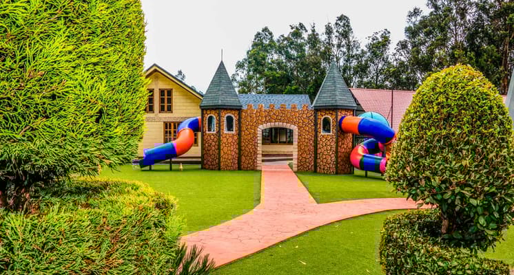 Colorful playground featuring a castle and slides