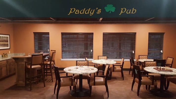 Interior view of Paddy's Pub with tables and chairs