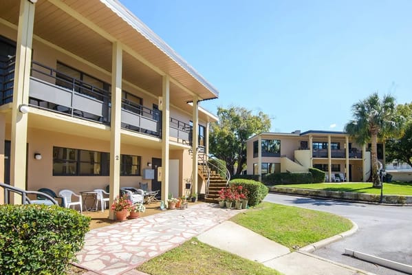 Exterior view of a senior living facility with landscaped areas