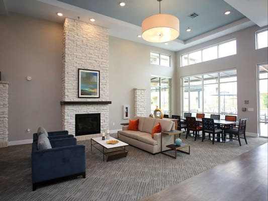 Spacious living room with seating and dining area.