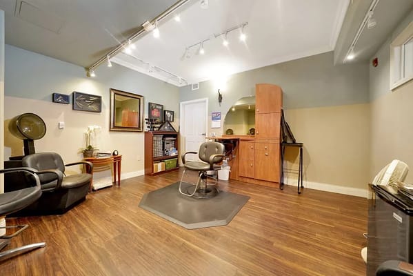 Interior view of a salon area with styling chairs