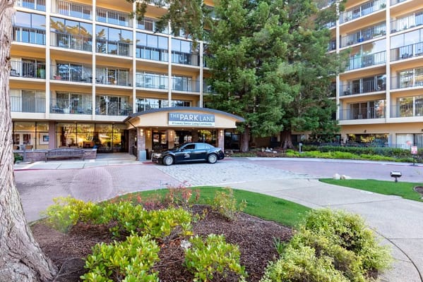 Entrance view of The Park Lane luxury senior living facility