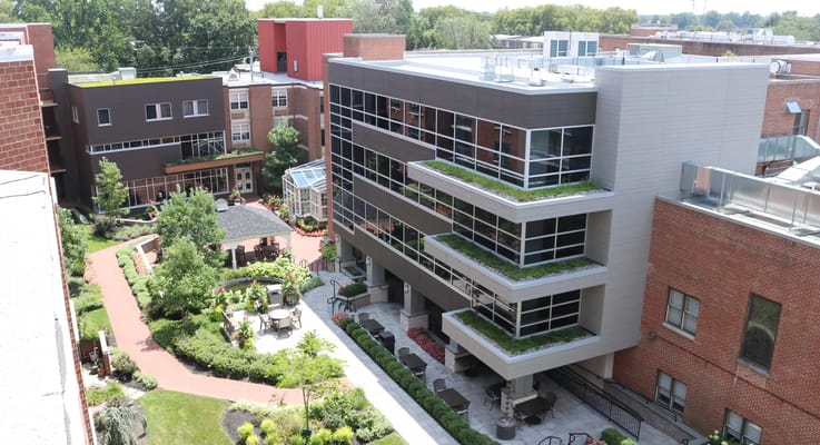Aerial view of The Philadelphia Protestant Home showcasing landscaped gardens and building architecture.