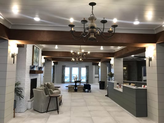 Spacious lobby area with seating and fireplace at The Phoenix at James Creek.