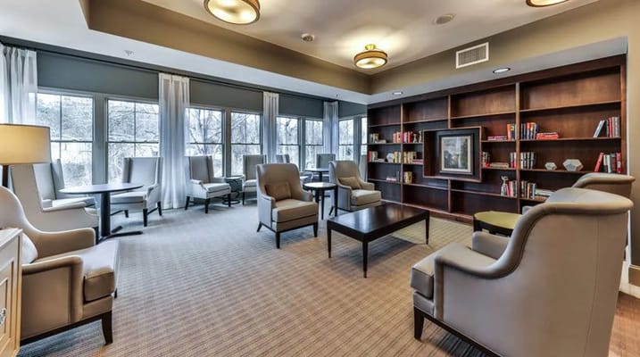 Comfortable lounge area with seating and bookshelves