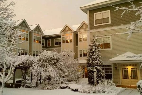 Snow-covered exterior of The Phyllis Siperstein Tamarisk Assisted Living Residence