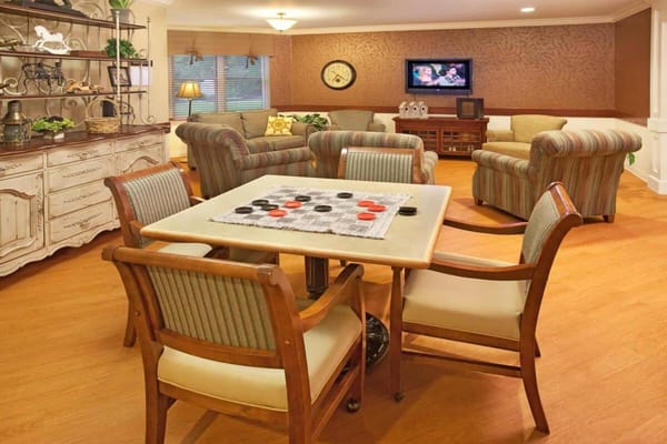 Lounge with checkerboard table and sofa seating