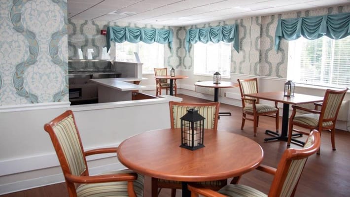 Bright common area with tables and chairs