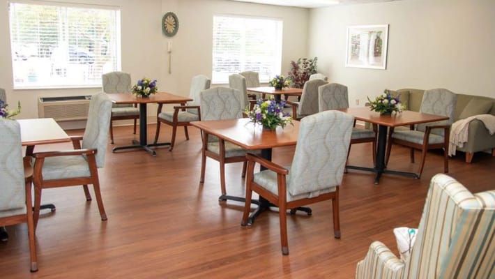 Interior view of a common area with tables and chairs