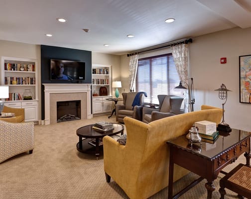 Bright common area with seating and a television