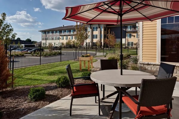 Outdoor seating area with umbrellas and building in background