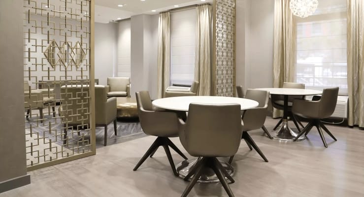 Modern interior common area with seating and tables