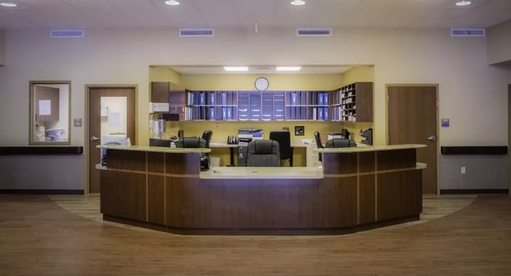 Reception area with a desk and office furniture