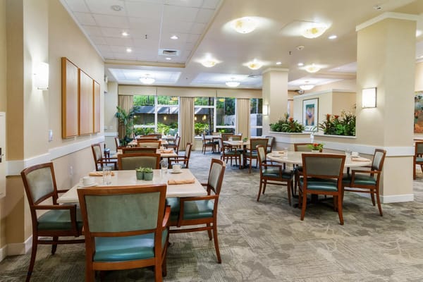 Cozy dining area with tables and chairs at The Plaza at Moanalua