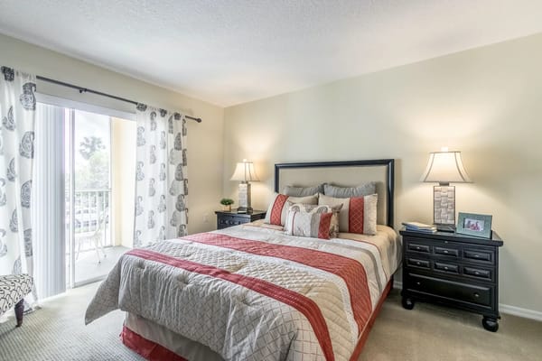 A cozy bedroom with a bed and natural light
