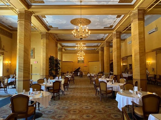 Elegant dining room with chandeliers and tables