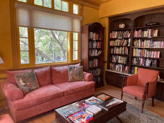 Cozy library corner with bookshelves and seating