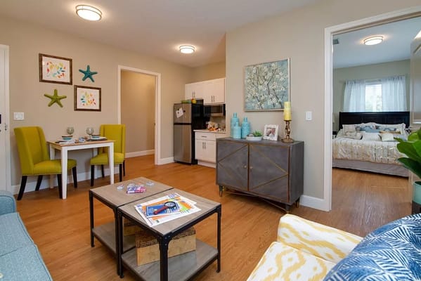 A stylish living room with a dining area and kitchen view.