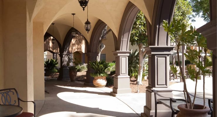 Courtyard with arches and potted plants