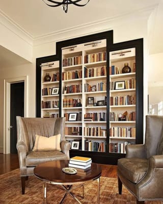 Inviting library area with a large bookshelf and comfortable seating